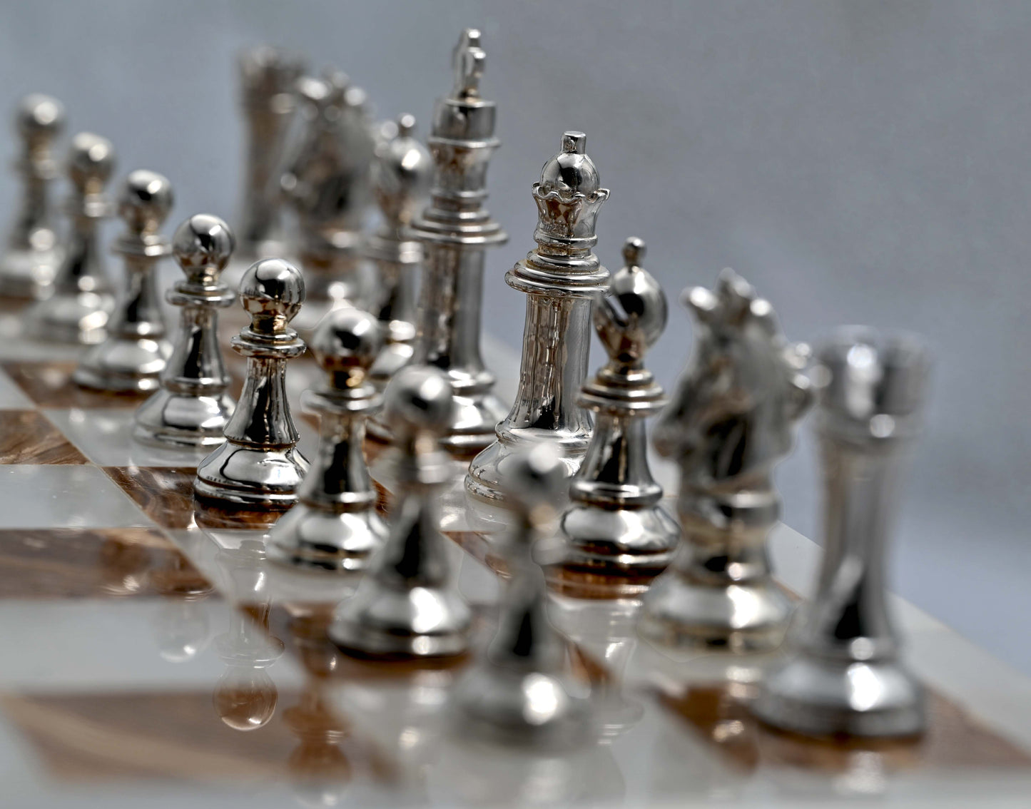 At Auction: A large ornate chess set with sterling silver board. Board  measures 46x46x8cm